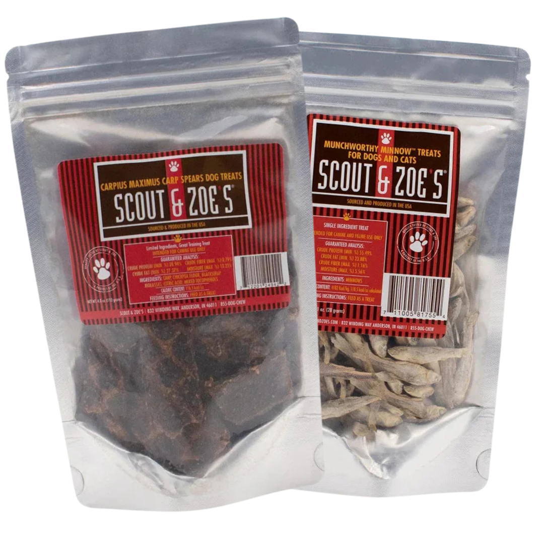 Two packages of dog treats labeled 'Scout & Zoe's', one with Munchworthy Minnows and another with Carp Spears, both transparent with red and white branding.